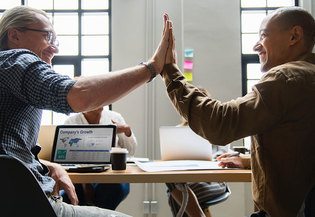 4community.online two men high five CMS for fundation