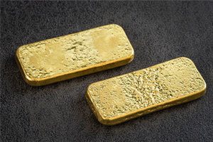 Goldbarren auf grauem Hintergrund