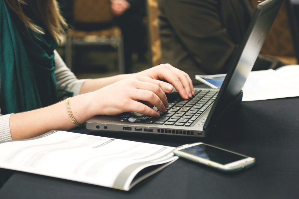 Writing on computer Creating content on computer