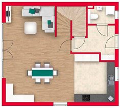 Hellgelbes Mehrfamilienhaus mit Terrasse und Garten