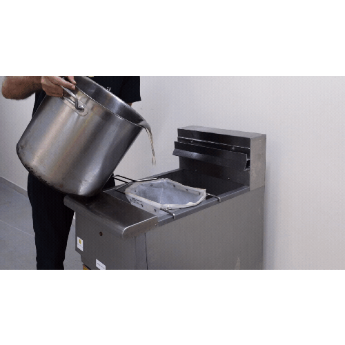 Pouring fresh oil into fryer