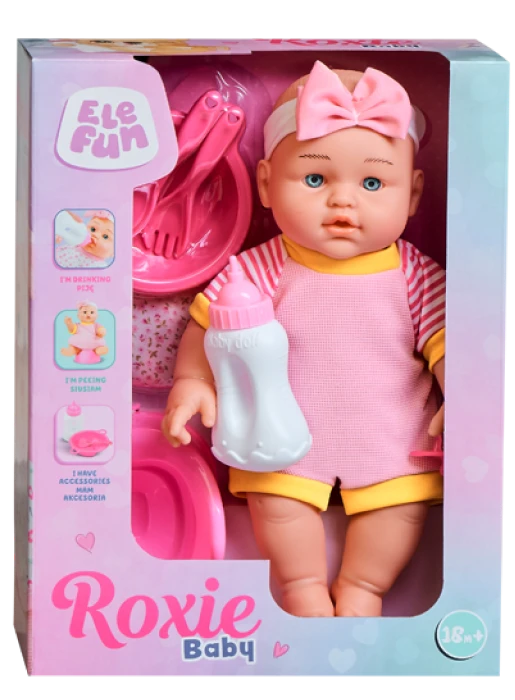 Lalka z kokardką w r&oacute;żowym ubranku, dodatkowo akcesoria talerzyk, butelka, miseczka, całość w pudełku