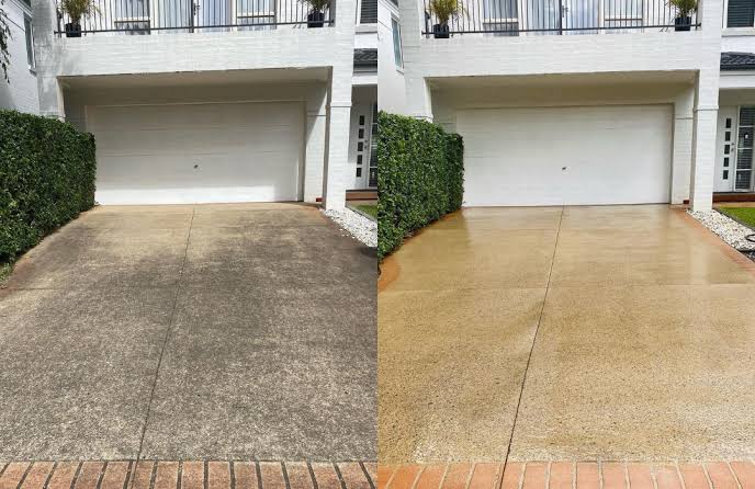 Residential concrete driveway being pressure cleaned