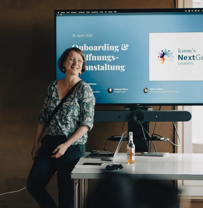 A hand with painted nails putting stickies on a wall
