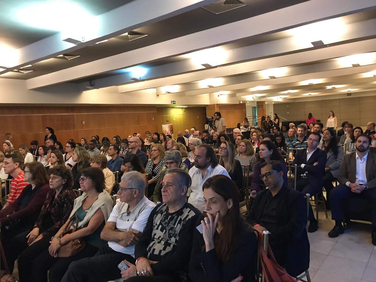 Audience members participating in a Debby Forman keynote