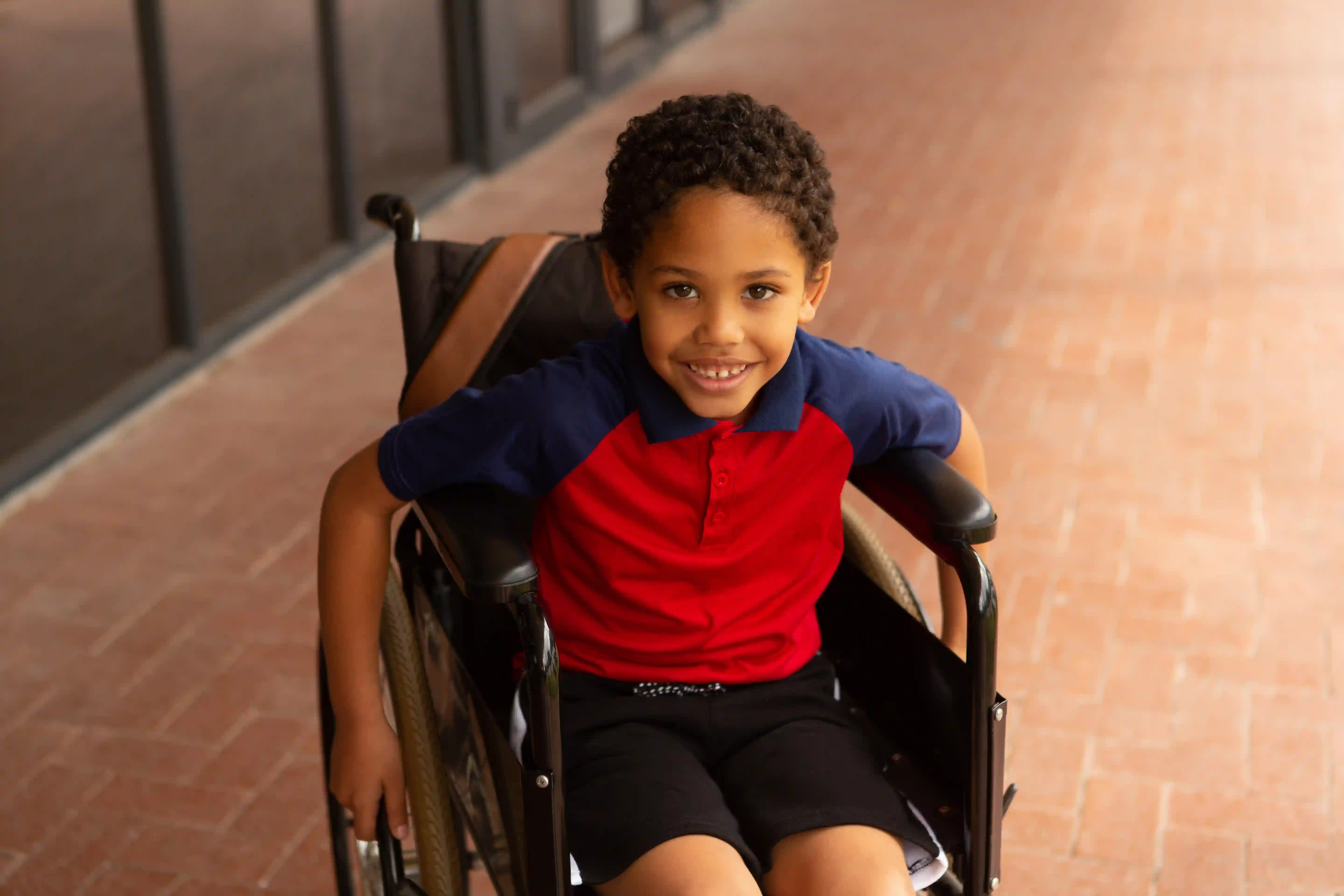 School boy smiling in corridor