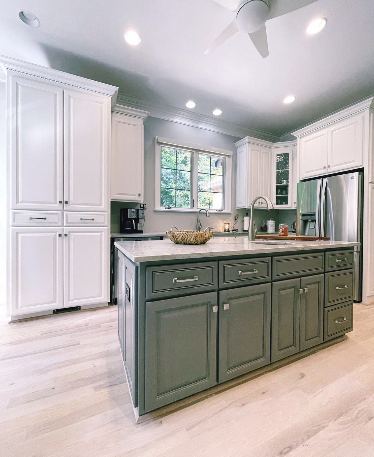 Refinished kitchen cabinets painted by Ukie Painting