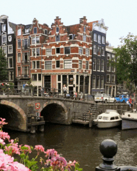 3 slide gif video highlighting Portugal, including a trolley car going up the street, a castle on the coast, and a view of white buildings with tile roofs.