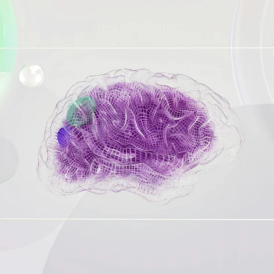 A young man holding up a sticky note showing the kiron logo