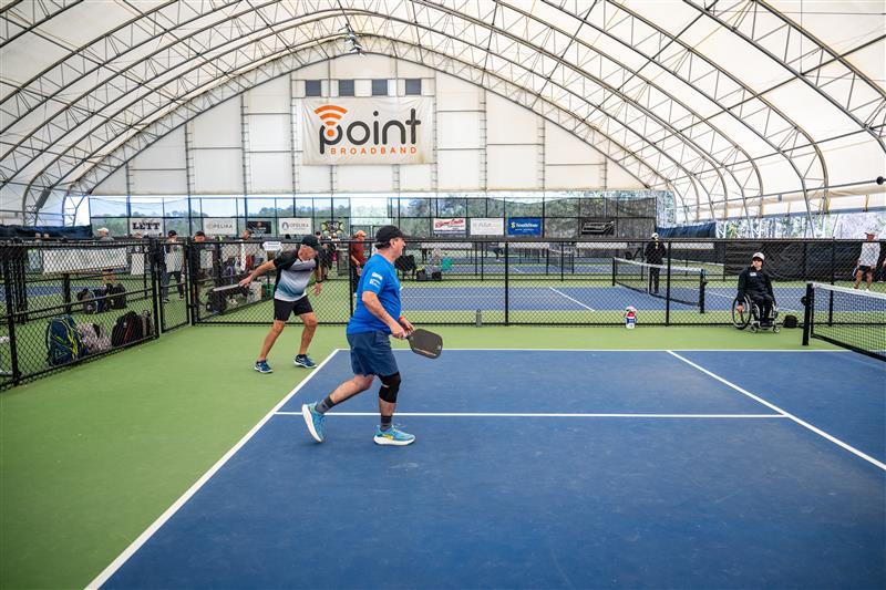 Softball field at Glen Ellyn's Ackerman Park lit at night with Musco LED fixtures