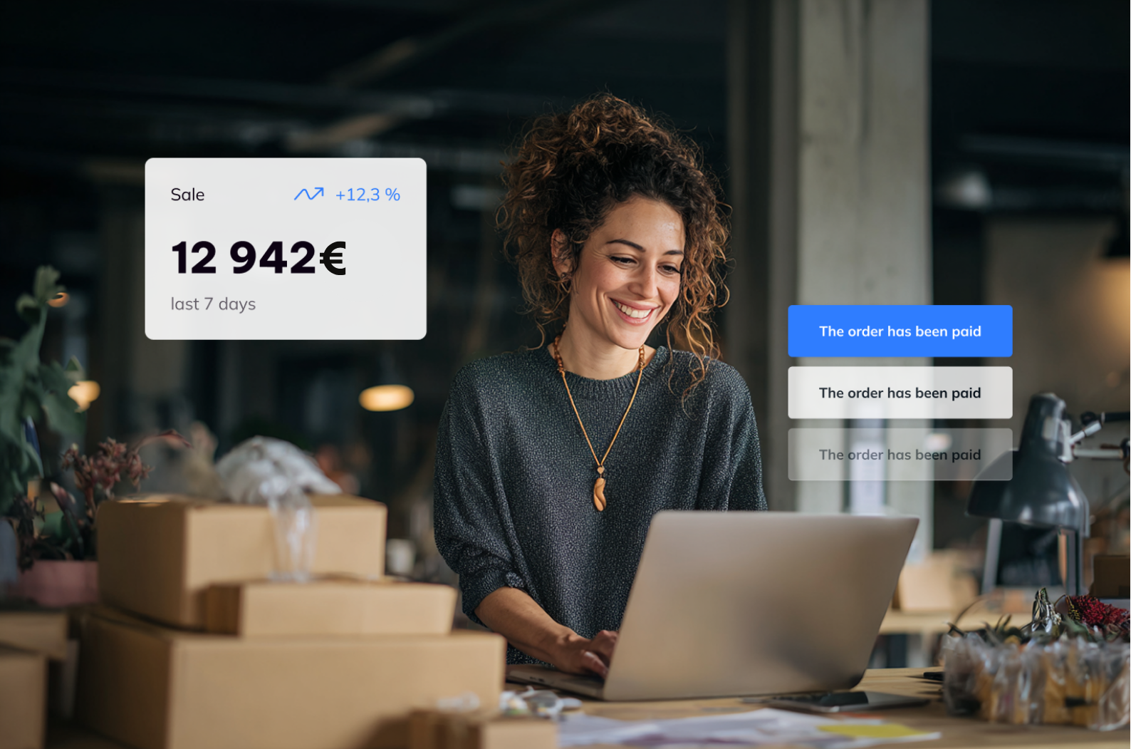 Frau überprüft Zahlungen und Gewinne innerhalb der Base Software. Wirtschaftsgrafiken schweben über ihrem Laptop.