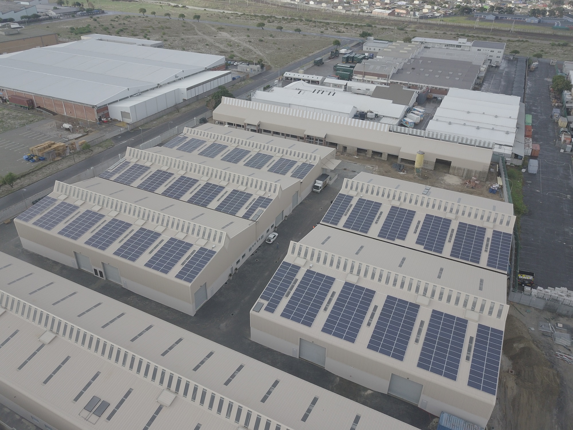 Aerial view of a 92kW grid-tied solar PV installation on a commercial dairy farm