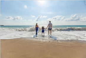 family on beach digital nomad vacation whenever you wish