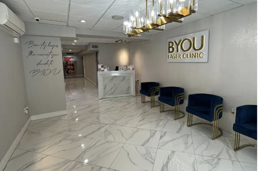 Modern minimalist BYou laser treatment room with contemporary furnishings