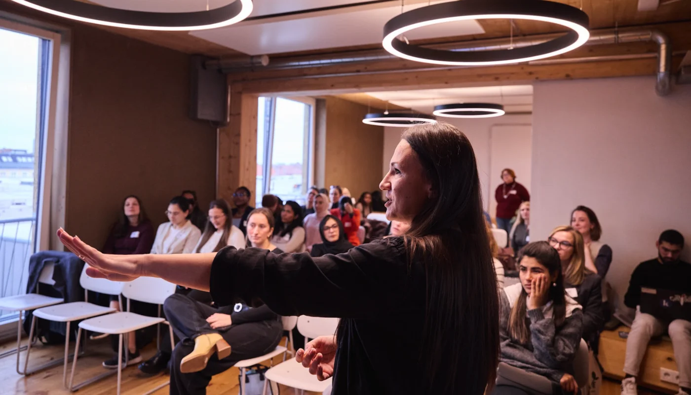 A poster presenting thrive sticking on a glass wall