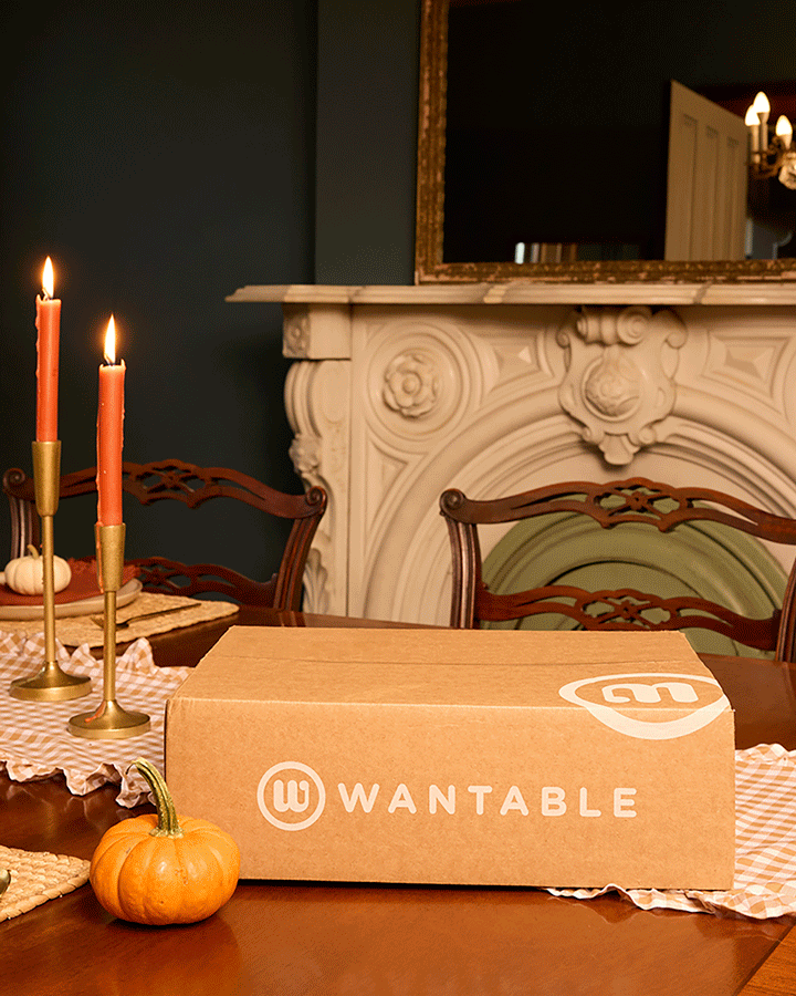 Shipping box on an autumn dining table opening to reveal what&rsquo;s inside