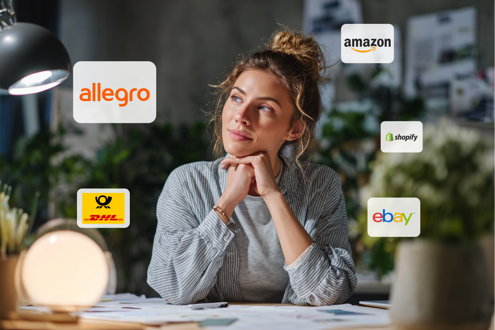 Frau schaut träumerisch zur Seite. Um sie herum sieht man Marken und Logos.