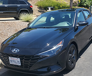 Glossy car exterior with mirror finish after mobile detailing Oceanside