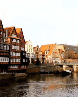 3 slide gif video highlighting Czech Republic, including a cityscape at night, a boat going under a bridge on the river, and people exploring the town.