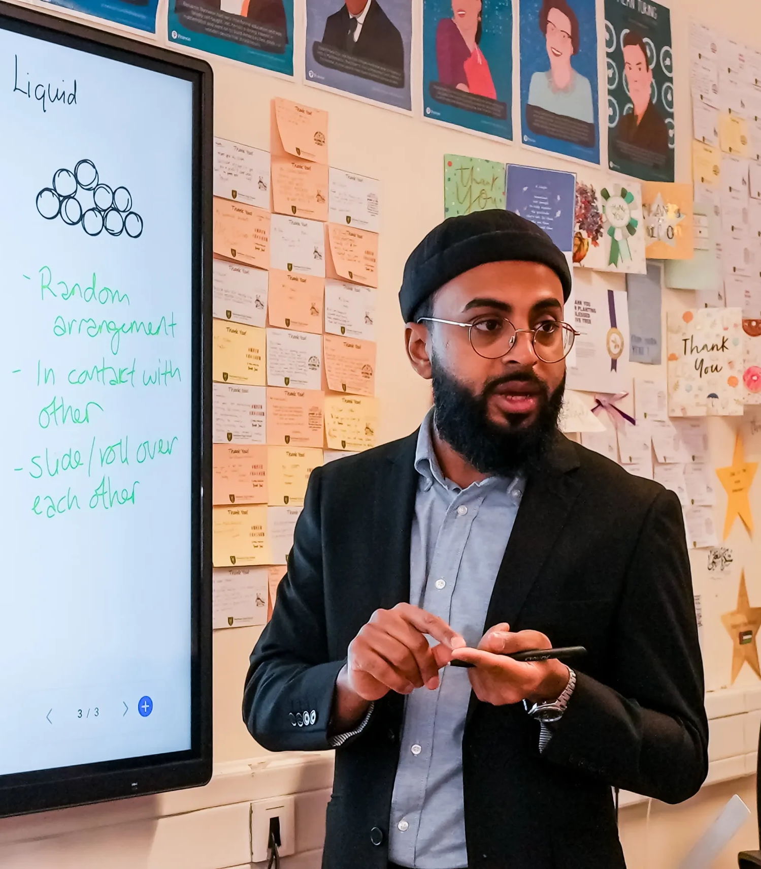 Ilford tuition classroom – teacher supporting KS3 students
