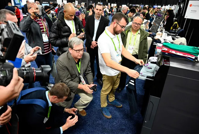 Reporters crowd our client's CES booth